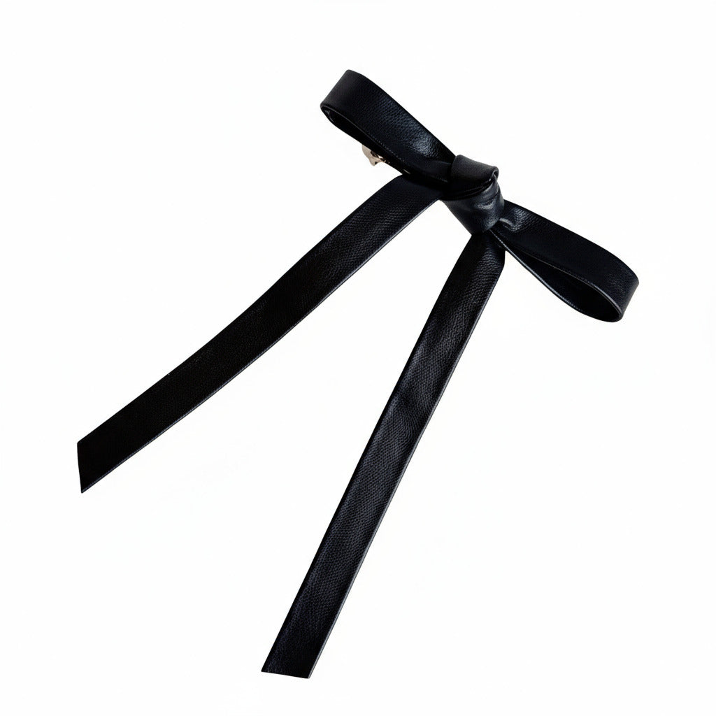 black hair bow on white background