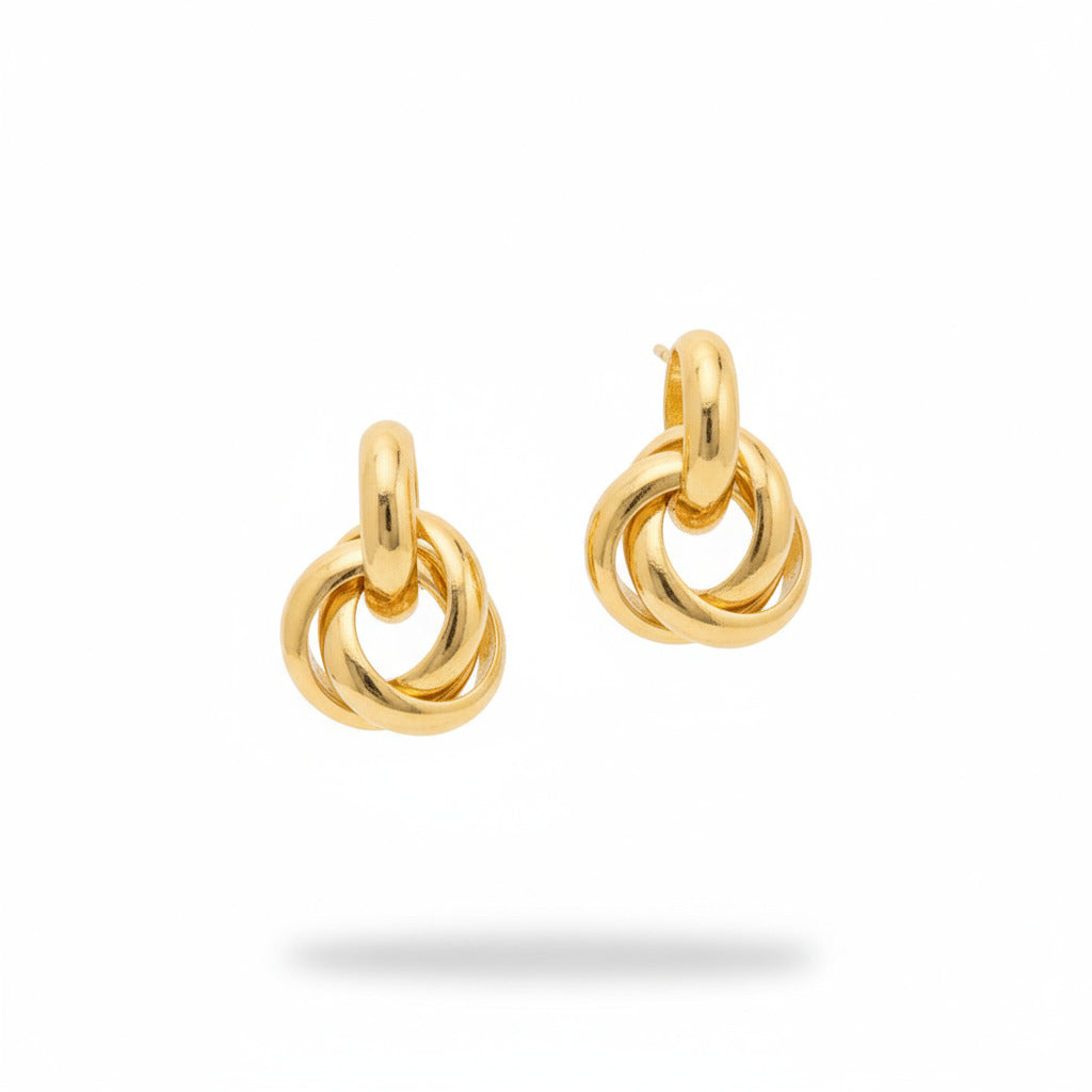 Gold hoop earrings on a white background