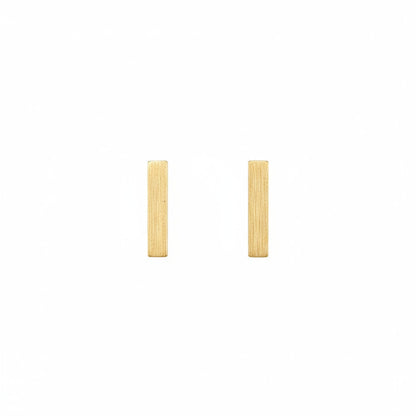 Gold bar earrings on a white background