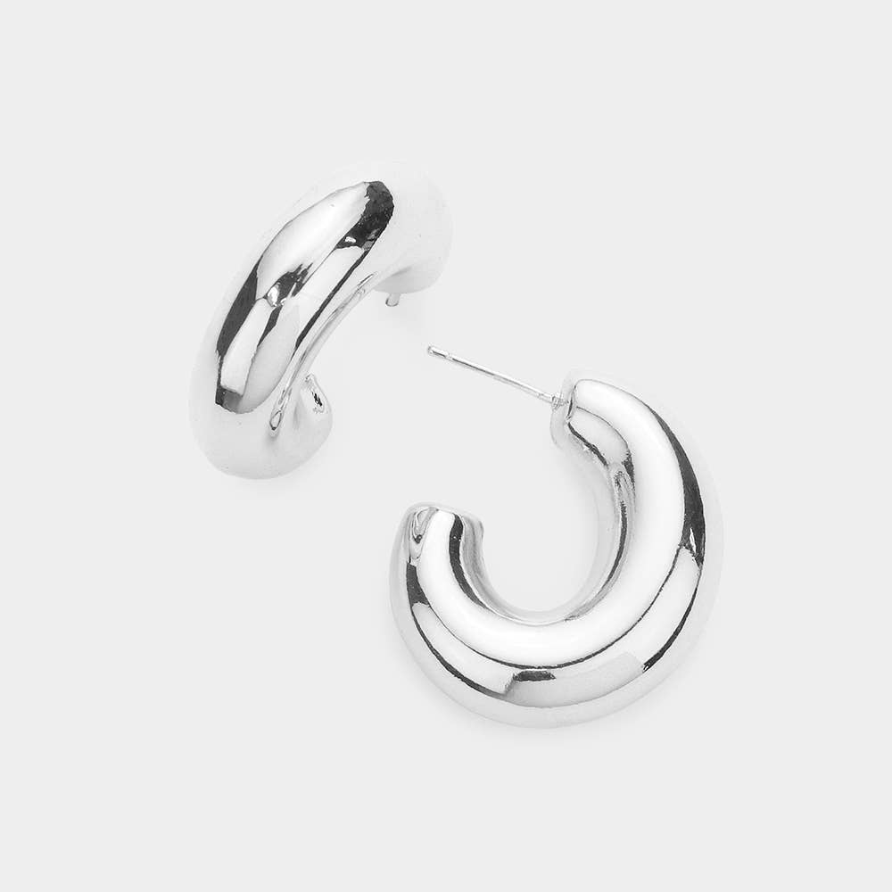 oval silver hoop earrings on a white background