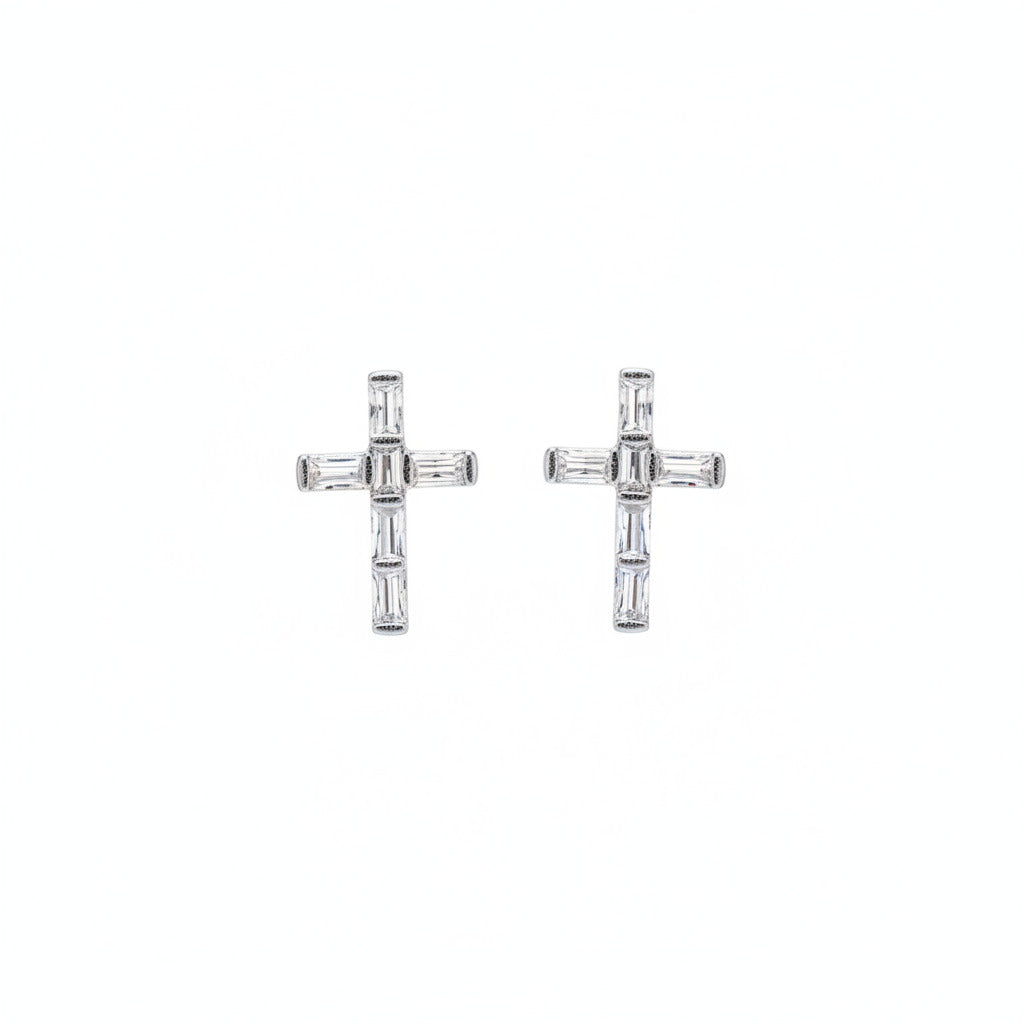 Pair of rhodium-plated cross earrings on a white background