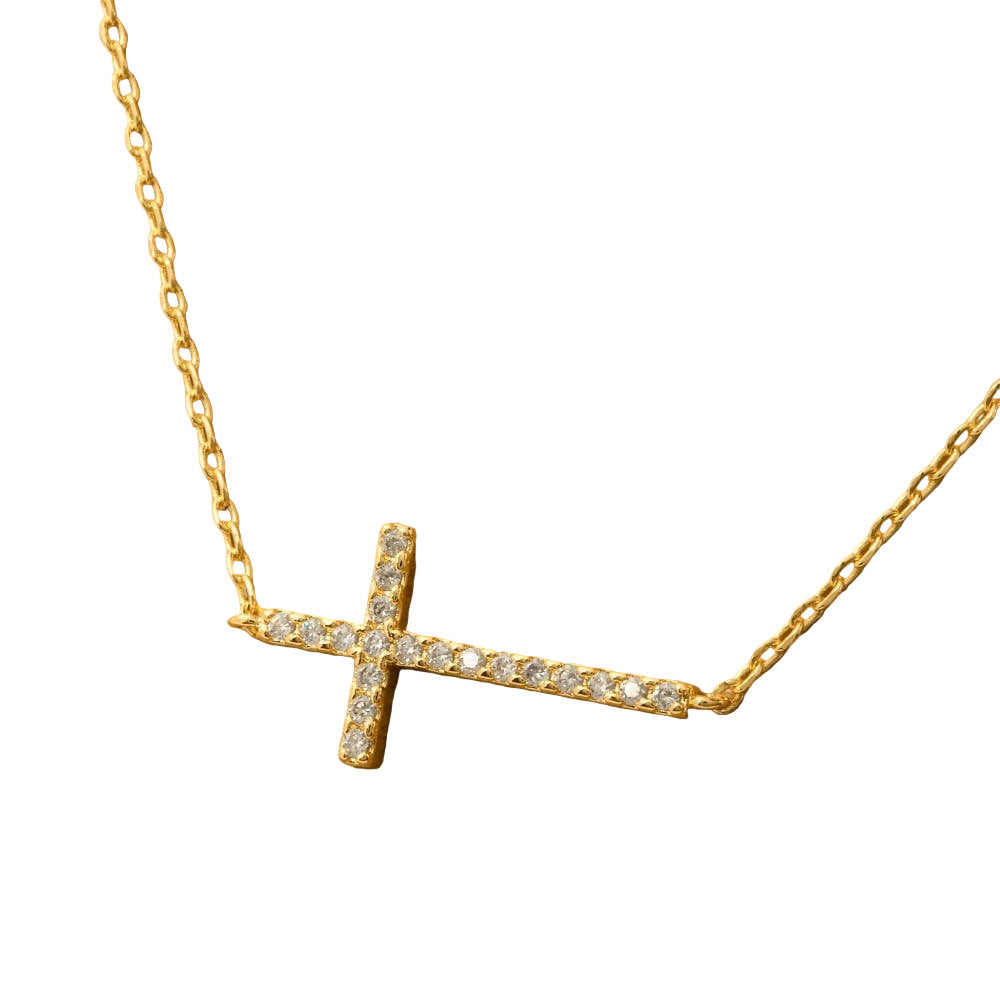 Gold necklace with a diamond-encrusted cross pendant on a white background