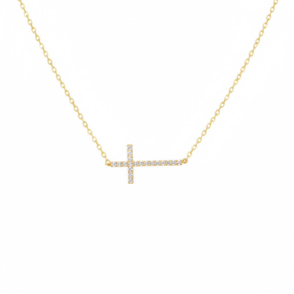 Gold necklace with a rhinestone cross pendant 