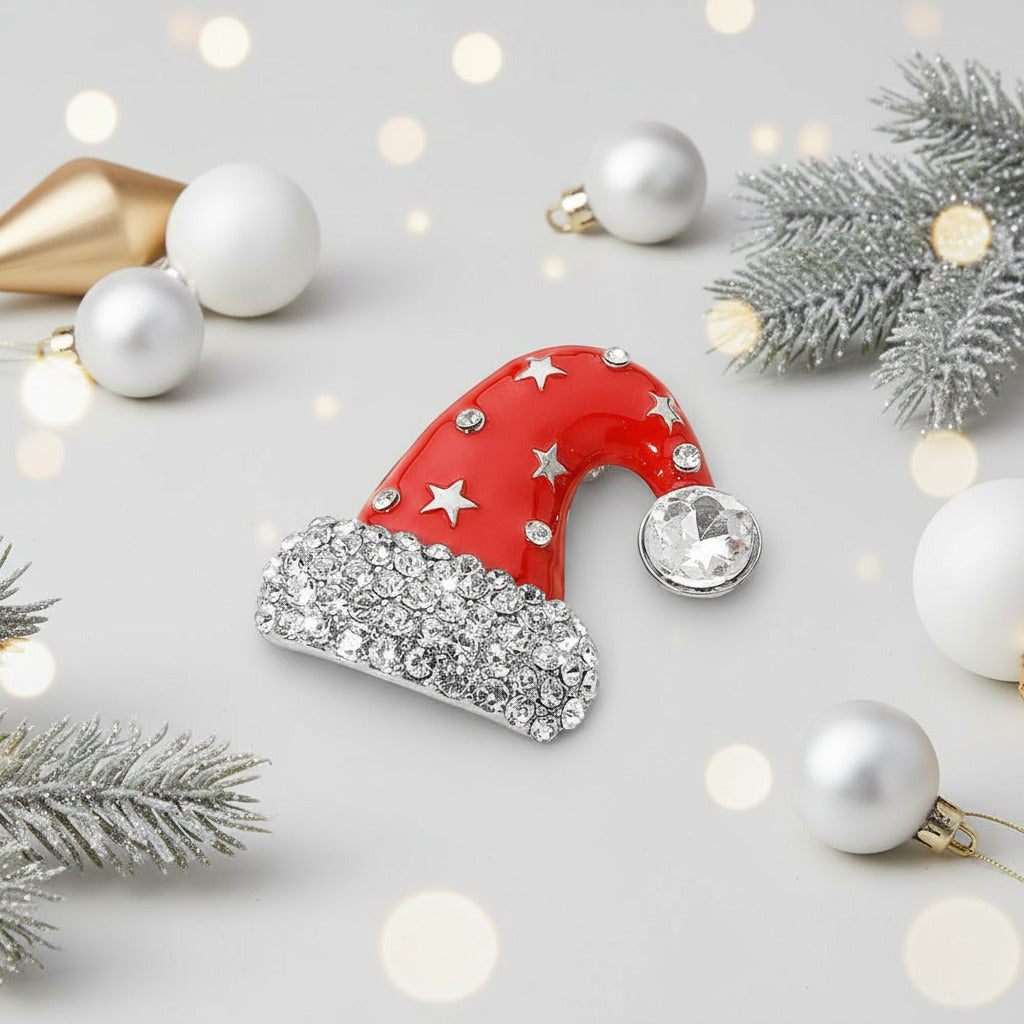 Red santa hat brooch with rhinestones on a festive background