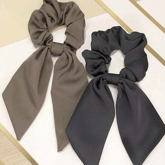 Two hair scarfs scrunchies, one brown and one black.