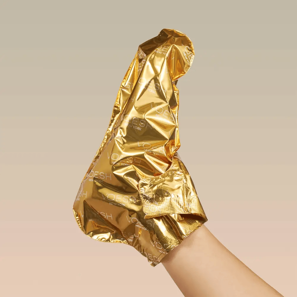 Gold sock on a beige background
